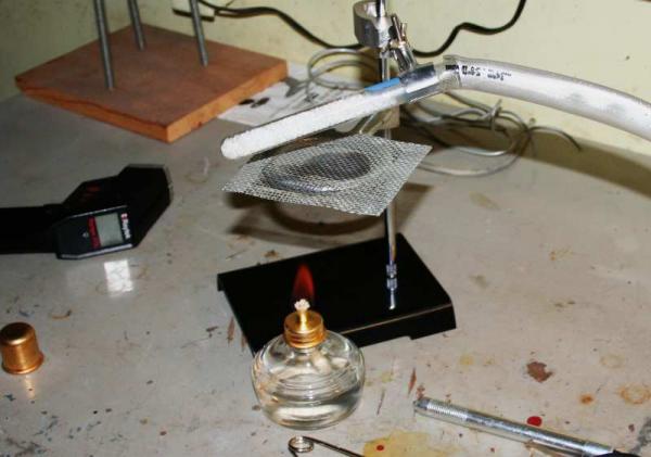 Heating the Desiccant with an Denatured alcohol (methylated spirits) (ethanol) lamp.